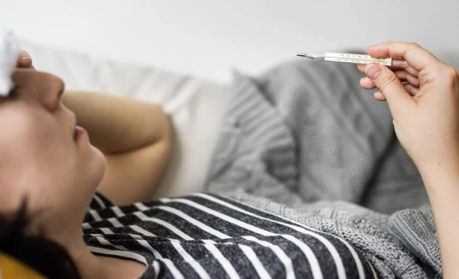 woman-with-a-cold-and-high-fever